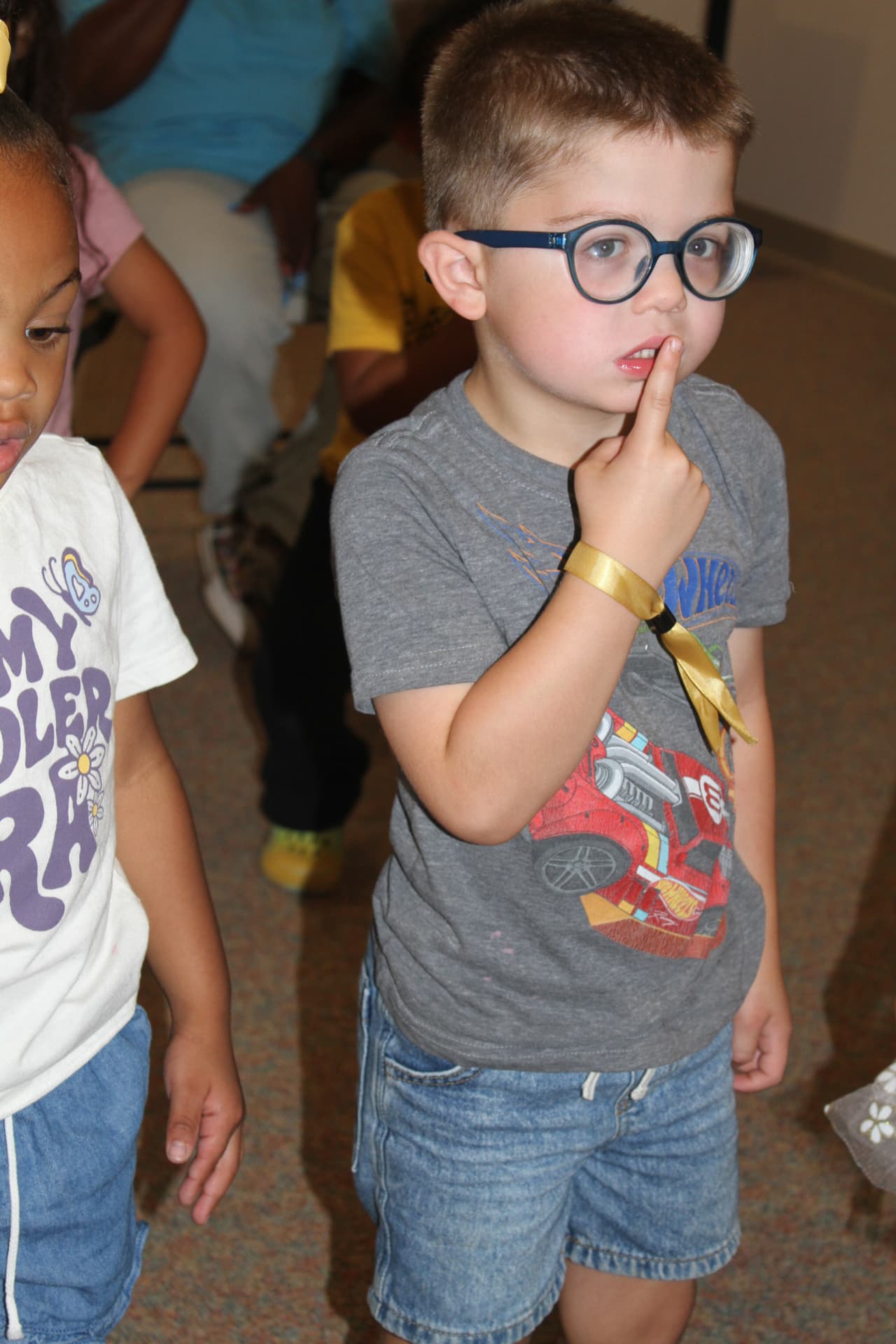A curious preschooler during music and movement